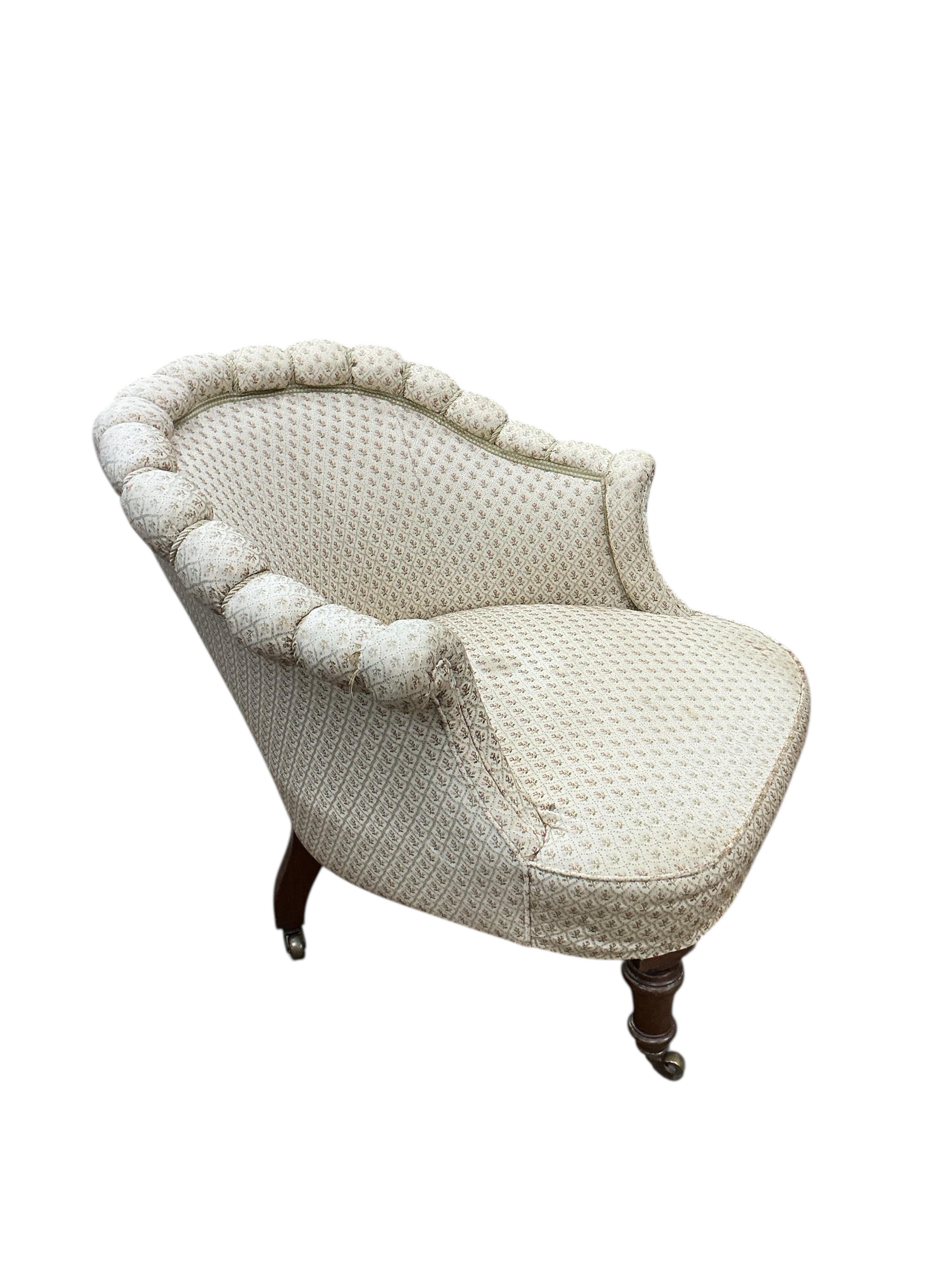 An early Victorian upholstered armchair, width 74cm, depth 76cm, height 74cm